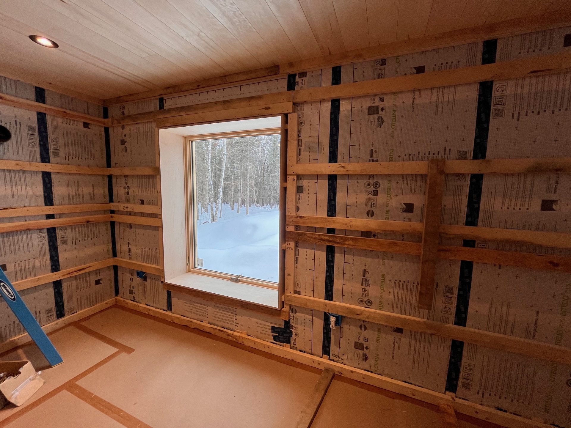 Interior of a strawbale home showing service cavity and strapping